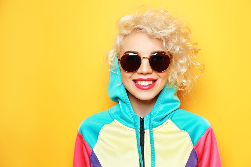 Fashion,Girl,In,Sportswear,On,Yellow,Background